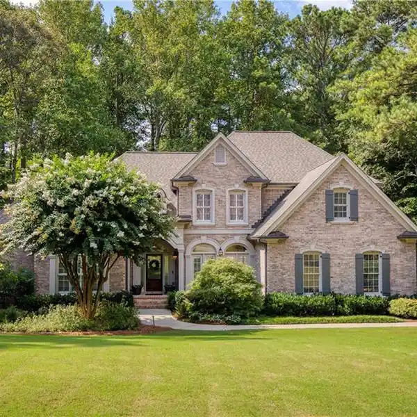 TIMELESS WHITE COLUMNS HOME WITH SCENIC PORCH