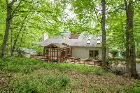 Unique Custom Contemporary on Private Wooded Property