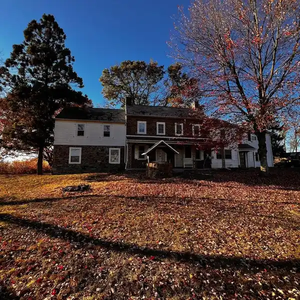 BRICK FIREPLACE ANCHORS FORMAL LIVING ROOM