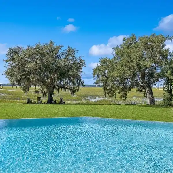 BEAUTIFULLY UPDATED CUSTOM HOME WITH MARSH-TO-RIVER VIEWS