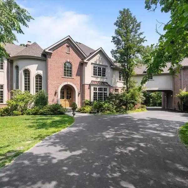 GORGEOUS CUSTOM HOME ON PRIVATE WOODED PROPERTY