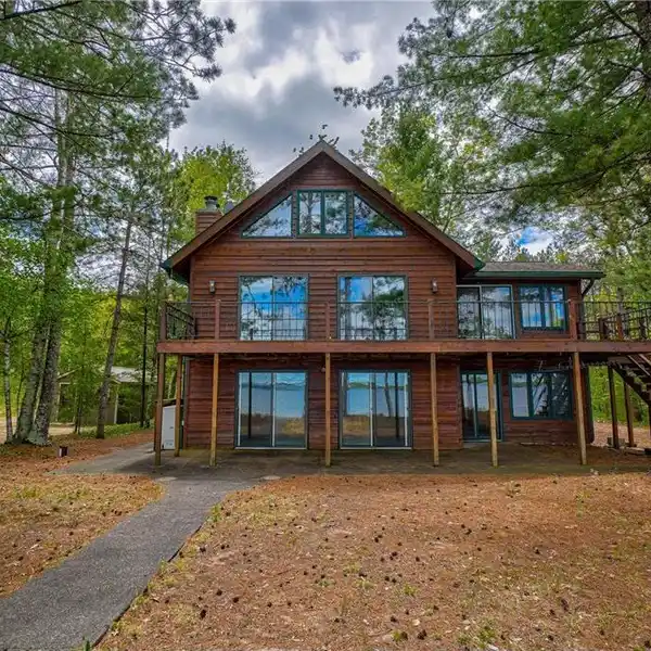 LAKEFRONT GEM WITH SANDY SHORELINE