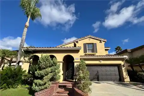 Mediterranean-Inspired Luxury Home with Resort-Style Backyard Oasis