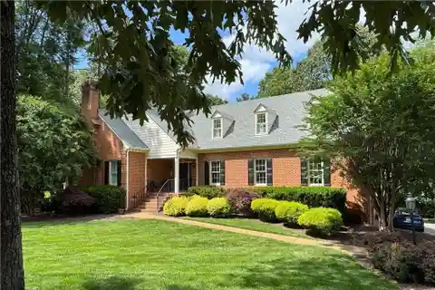 Expansive Brick Beauty with Wooded Backyard Views