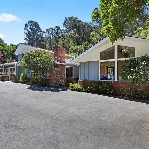 SECLUDED EQUESTRIAN ESTATE WITH TWO HOMES AND RIDING ARENA