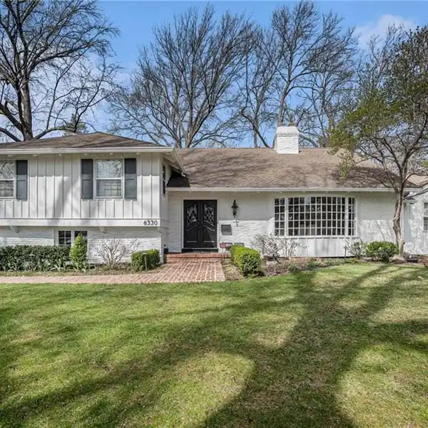 BEAUTIFUL HOME ON A HEAVILY LANDSCAPED LOT