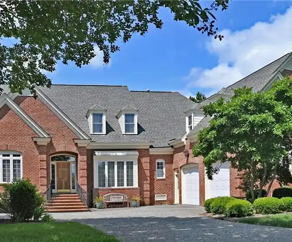 GORGEOUS POND-FRONT BRICK HOME