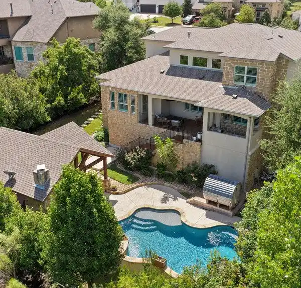 BEAUTIFULLY LANDSCAPED HOME IN ROUGH HOLLOW'S LAKEWAY HIGHLANDS