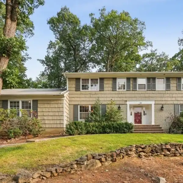 LUSHLY LANDSCAPED COLONIAL WITH GLASS BREAKFAST ROOM