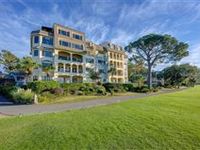 TWO-STORY PENTHOUSE ON THE ICONIC 18TH HOLE OF HARBOUR TOWN GOLF COURSE