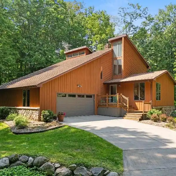 METICULOUSLY CARED FOR HOME ON A WOODED RETREAT