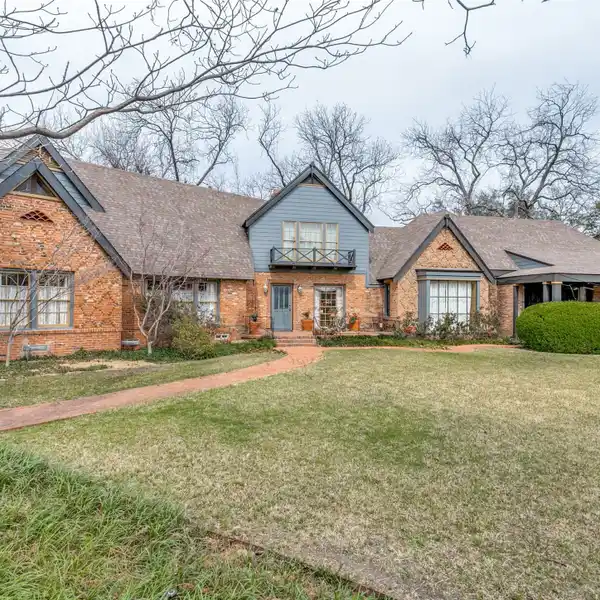 EXPANDED AND UPDATED HOME ON A SPRAWLING LOT