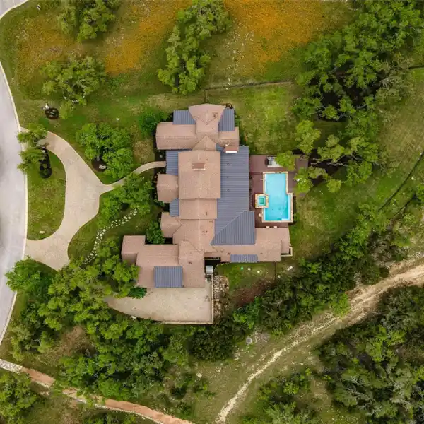 THE EPITOME OF HILL COUNTRY LIVING IN COVETED BELVEDERE