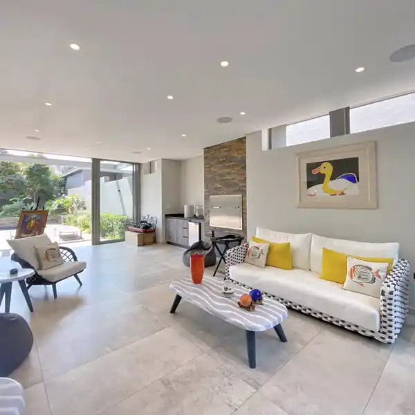 SUNLIT SOPHISTICATION WITH PARTY-READY PATIOS