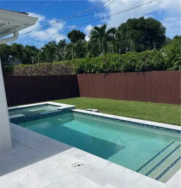 ELEVATED COASTAL COTTAGE WITH RESORT-STYLE POOL