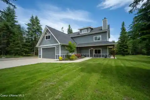 Grand Home with Wraparound Porch and Workshop