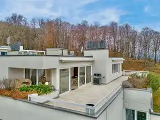 Elegant Penthouse Apartment with a View of Lake Lugano