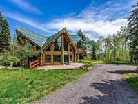 THOUGHTFULLY DESIGNED LOG HOME ON OVER 11 ACRES
