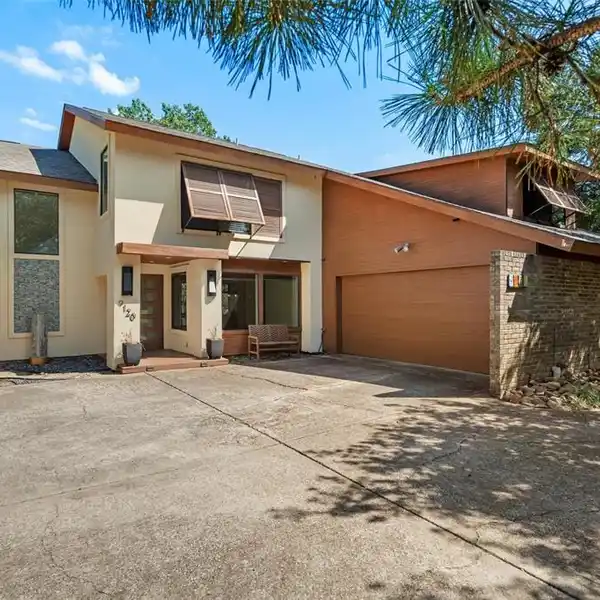 LUXURIOUS FIVE BEDROOM HOME ON A CREEK LOT IN LAKE HIGHLANDS