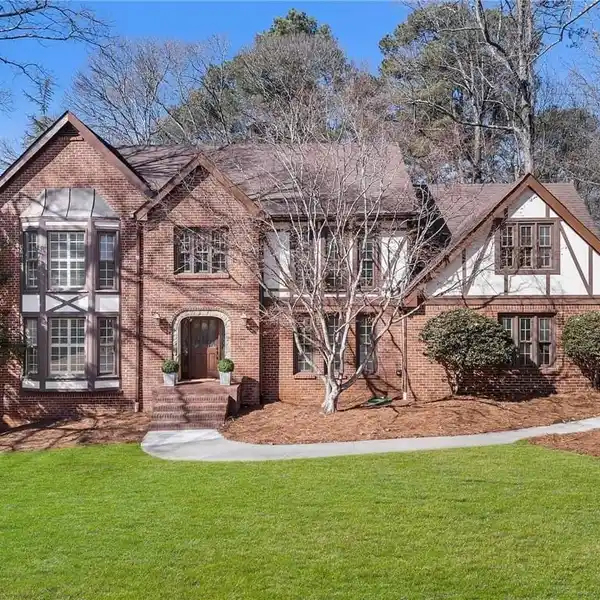 TUDOR-STYLE HOME IN SOUGHT-AFTER SIBLEY FOREST