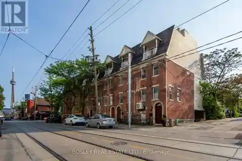 Victorian-Inspired Red Brick Townhouse with Rooftop Terrace