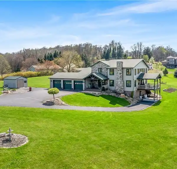 ONE-OF-A-KIND CUSTOM FARMHOUSE ON 11.5 ACRES