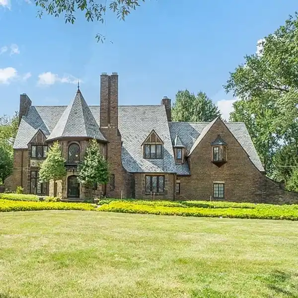 CLASSIC 1920S TUDOR WITH CREEKSIDE LANDSCAPING