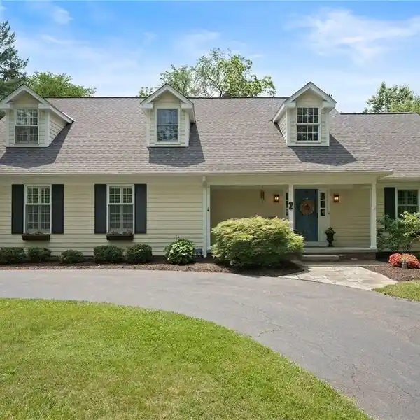 EXTENSIVELY UPDATED 1980 CAPE COD ON A WOODED LOT
