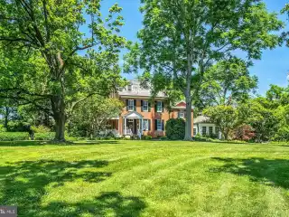 Manor House with Paneled Library and Sunroom
