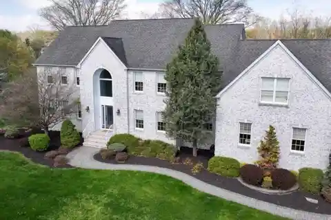 Elegant Home Boasts Grand Staircase and Pool