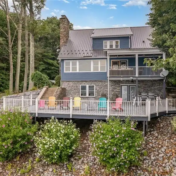 STUNNING ONEIDA LAKEFRONT ESTATE WITH GUEST HOUSE