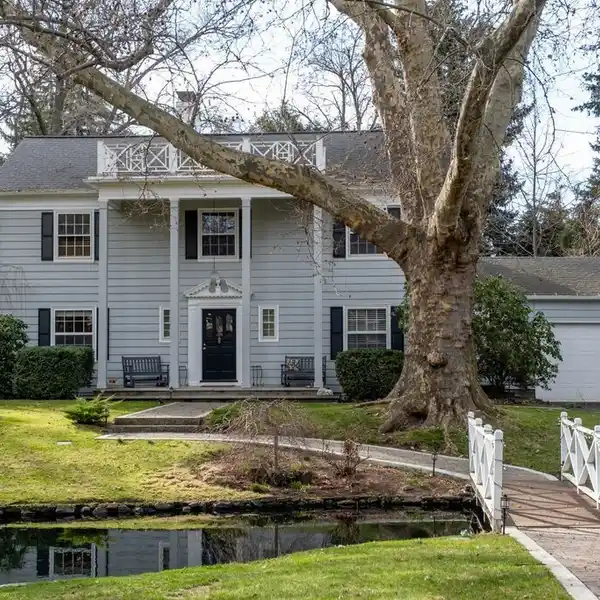 STUNNING COLONIAL HOME IN A GARDEN SETTING
