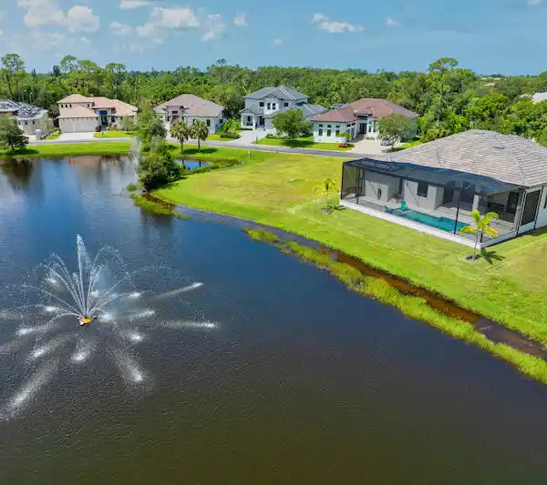 SOPHISTICATED WATERFRONT LIVING WITH DESIGNER TOUCHES AND POOL