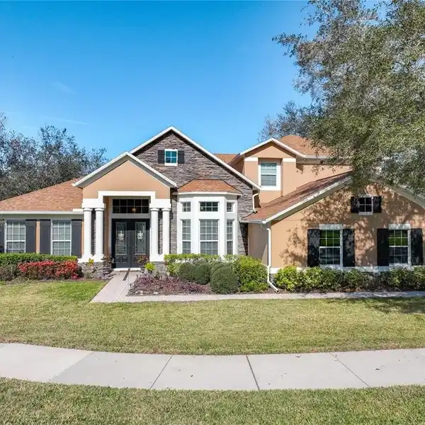 METICULOUSLY CARED FOR HOME IN THE GATED WEKIVA RUN COMMUNITY