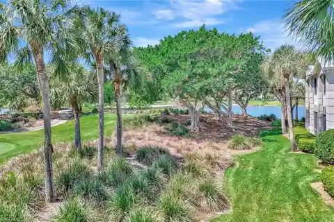 Upper-floor End Unit with Panoramic Golf and Water Views