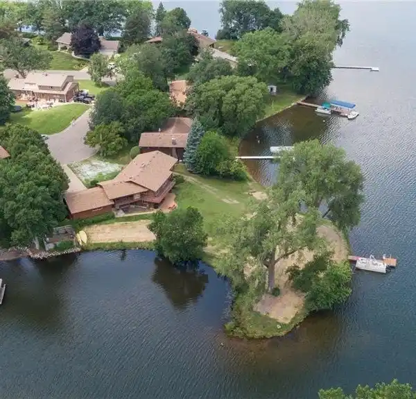 RARE PENINSULA SETTING ON LAKE OWASSO