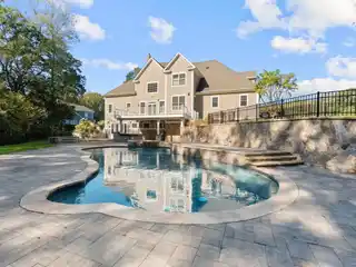 Gorgeous Woodland Setting with Custom Stone Walls and Landscaping