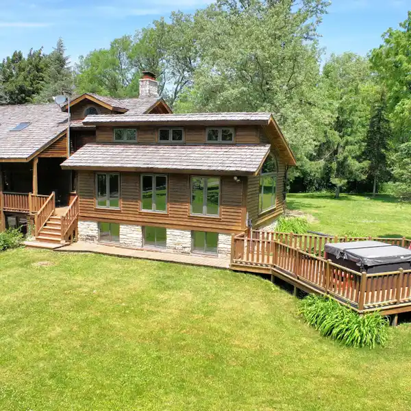 UNIQUE LOG HOME ON 49.55 WOODED ACRES