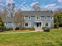 CLASSIC CENTER HALL COLONIAL ON LUSH PROPERTY