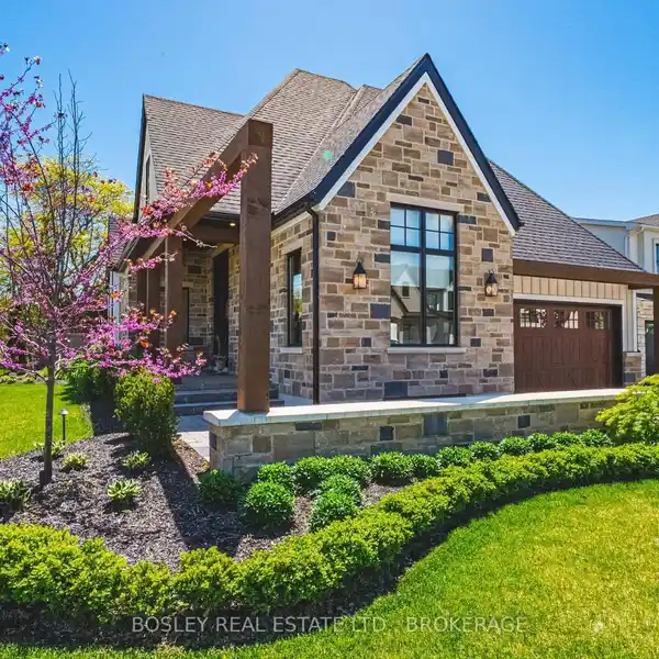 CUSTOM-DESIGNED BUNGALOW WITH ELEGANT LANDSCAPING AND ARCHITECTURAL DETAIL