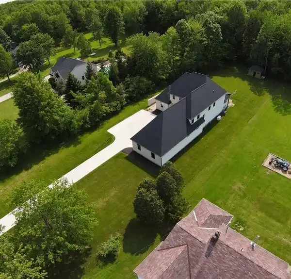 BOLD NEW-BUILD WITH ACRE OF WOODED PRIVACY