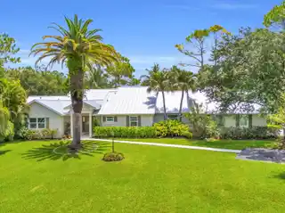 Tropical Poolside Living on Expansive Acreage