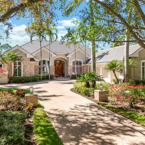 CUSTOM ESTATE HOME WITH SERENE GOLF AND LAKE VIEWS