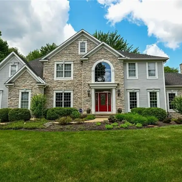 STATELY COLONIAL IN A WOODED SETTING
