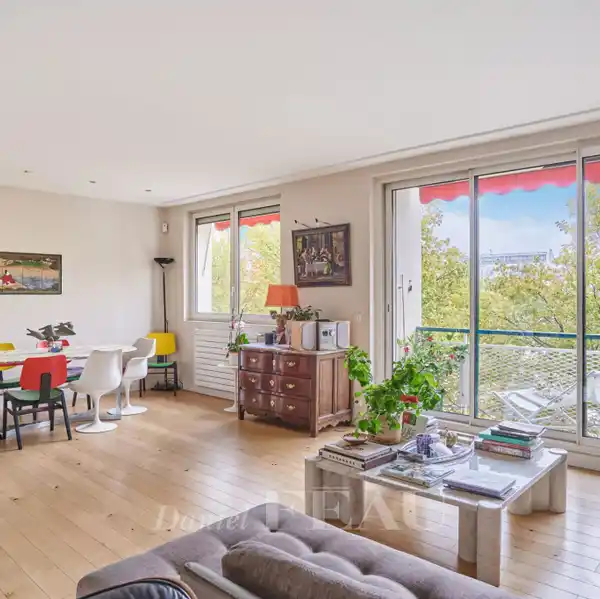 BRIGHT SEINE-VIEW APARTMENT WITH CONTINUOUS BALCONY CHARM