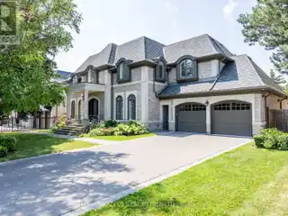 Indiana Limestone Showpiece with Designer Interiors & 4-Car Garage