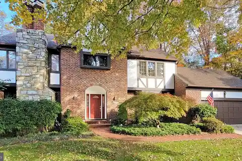 Stylish Wet Bar, Recreation Room, and Multiple Living Areas