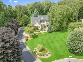 Timeless Center-Hall Colonial Set on Beautifully Landscaped Grounds