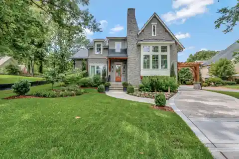 Storybook Modern Tudor Home with Carriage House