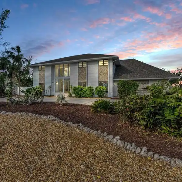 EXCEPTIONAL CUSTOM HOME ON A SPACIOUS CORNER LOT